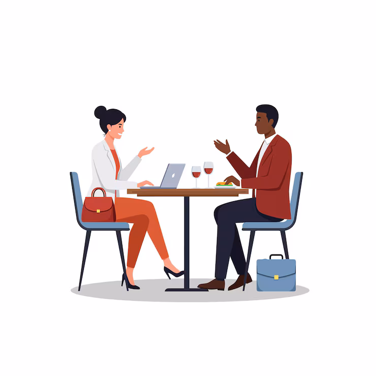 Man and woman collaborating at a desk with charts and graphs